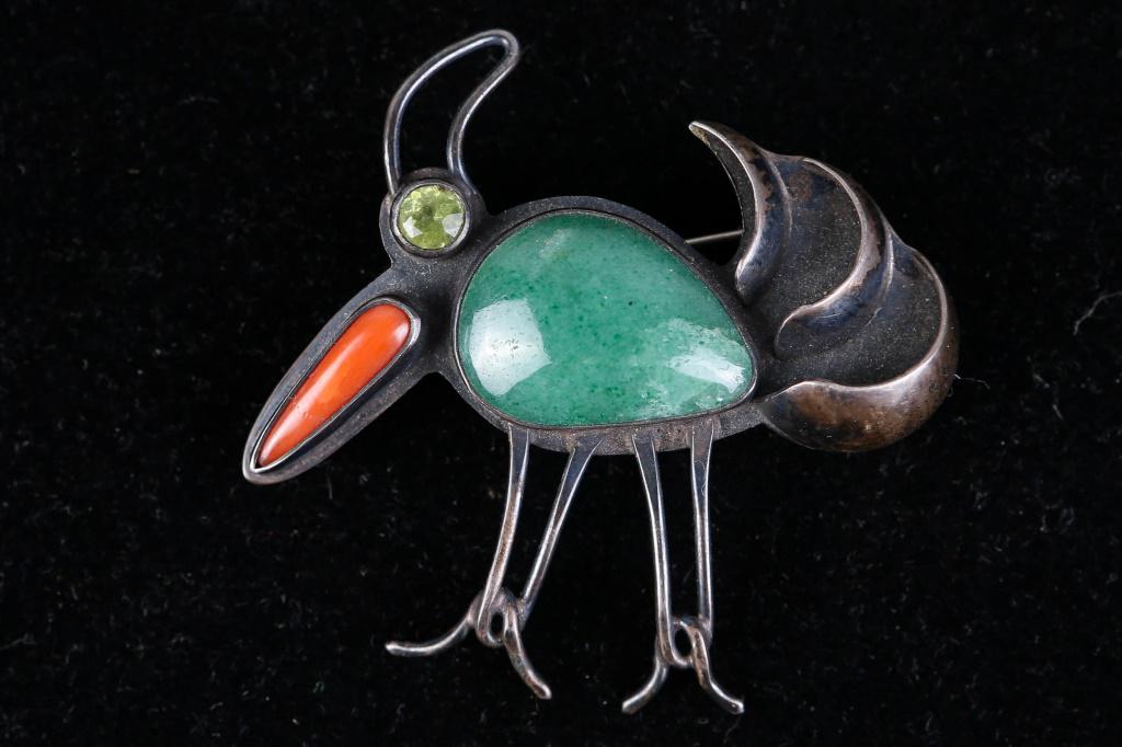 Mid Century Modern Sterling Silver Bird Brooch: Brooch measures 2.25" across, and is marked made in Israel, 925. Item has jadeite, coral, and peridot stones.