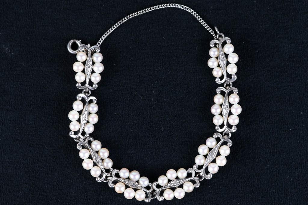 Antique Mikimoto Bracelet: Sterling and pearl bracelet with 48 pearls and sterling sections. Signed "M" for Mikimoto.
