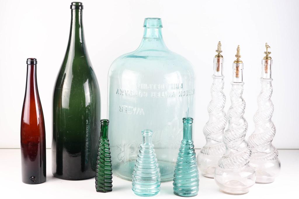 Purock, Carboy and Other Old Bottles: includes a "Purock" water bottle (approximately 19"H), a Jerabone, and various other bottles.