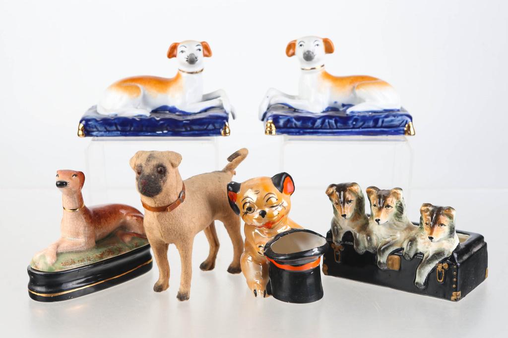 Staffordshire Whippets and other Dog Figures: includes a pair of Staffordshire whippets, a Fitz and Floyd dog trinket box, a Chase Collie planter, and other dogs.