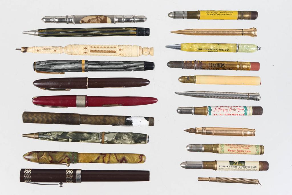 Collection of Vintage Pens and Pencils: Pens and pencils with celluloid bodies, a carved pencil holder that appears to be from India, vintage advertising and souvenir bullet pencils, and others. Approximately (20) pieces. Nibs include Sheaf