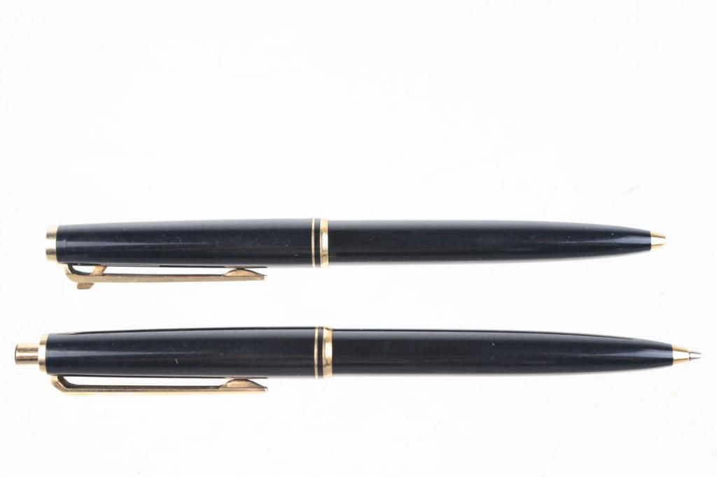 Mont Blanc Pen and Pencil Set: Two Montblanc similar style pen and pencil. First pen: twists to open, and is a German pen. Second pencil: Press button to open pen, also made in Germany.