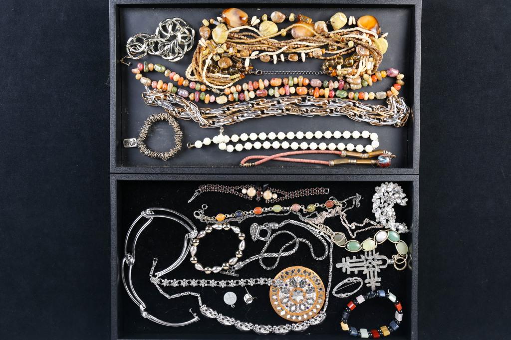 Monet Necklace and Other Costume Jewelry: includes silver tone collar necklace marked Monet, large rhinestone brooch, multi color rhinestone necklace, floral clear rhinestone bracelet, scarab bracelet, decorative pocket mirror, and stone and