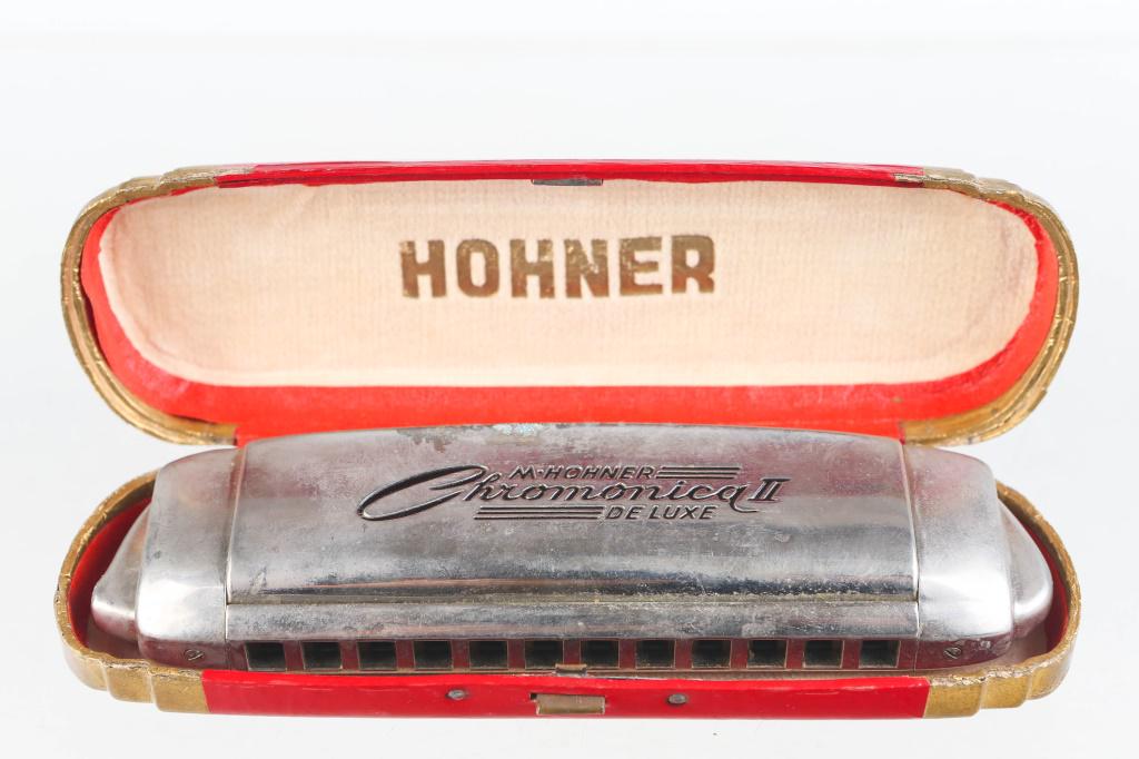 Hohner Chromonica 2 Deluxe Harmonica: Approximately 6.5" across. Made in Germany. Fully functional with chromatic slide. C Key. In original case with loss to surface.