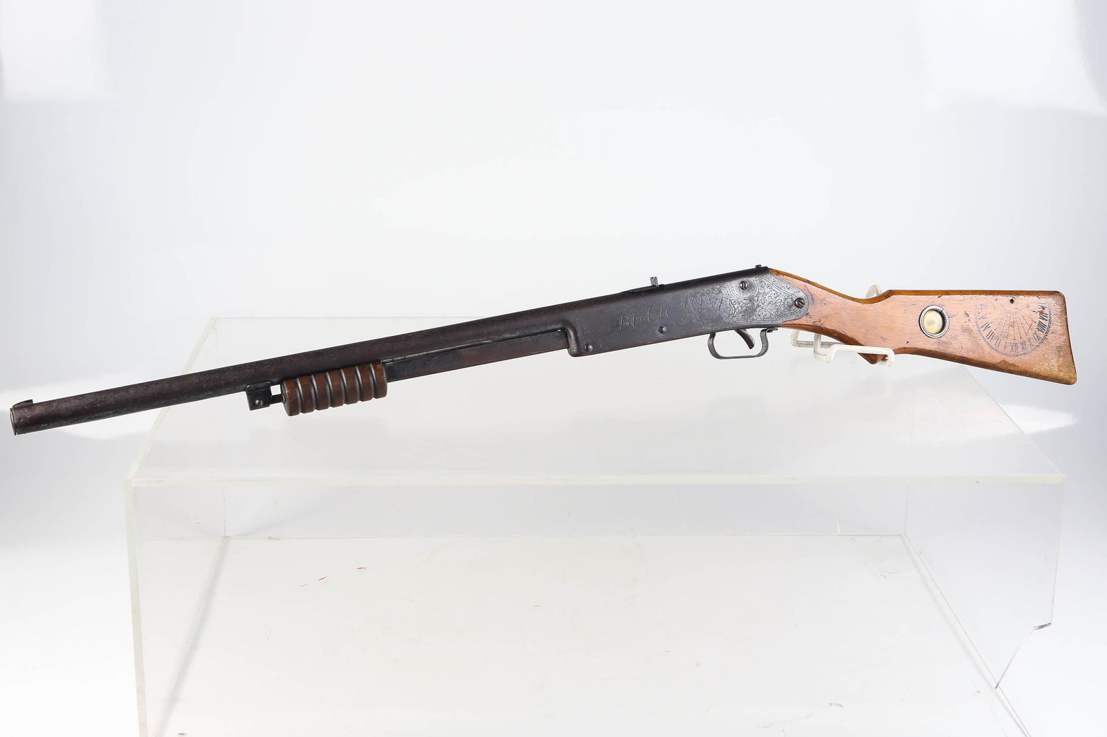 Buck Jones Daisy BB Gun w/Compass Sundial c1934: Daisy model Number 107 marked on top of barrel and compass and sundial in the handle on left side. The pump under barrel pumps but trigger feels loose, oxidation and signs of use. Daisy had the Buzz B