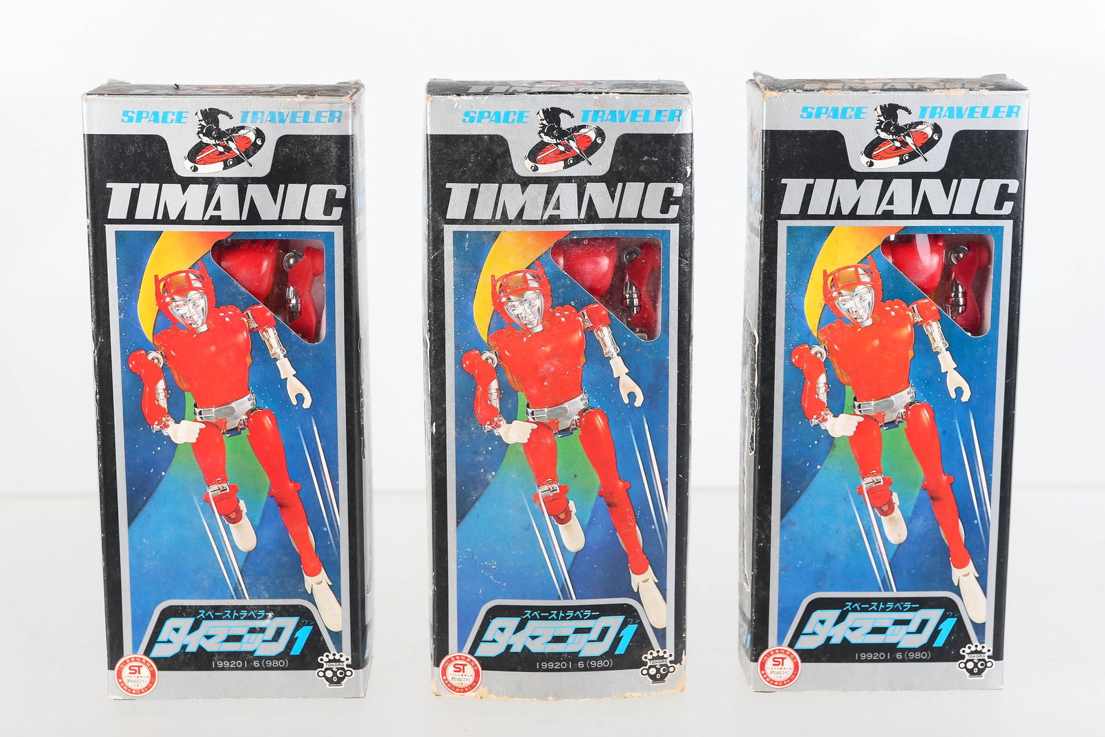 Three Timanic Robots in Original Boxes: Robots are made by Takara circa 1970 model #199201-6, unplayed with in original boxes (wear to box). Face helmets on all robots break away from face from aging. Timanic was a space traveler from a Jap
