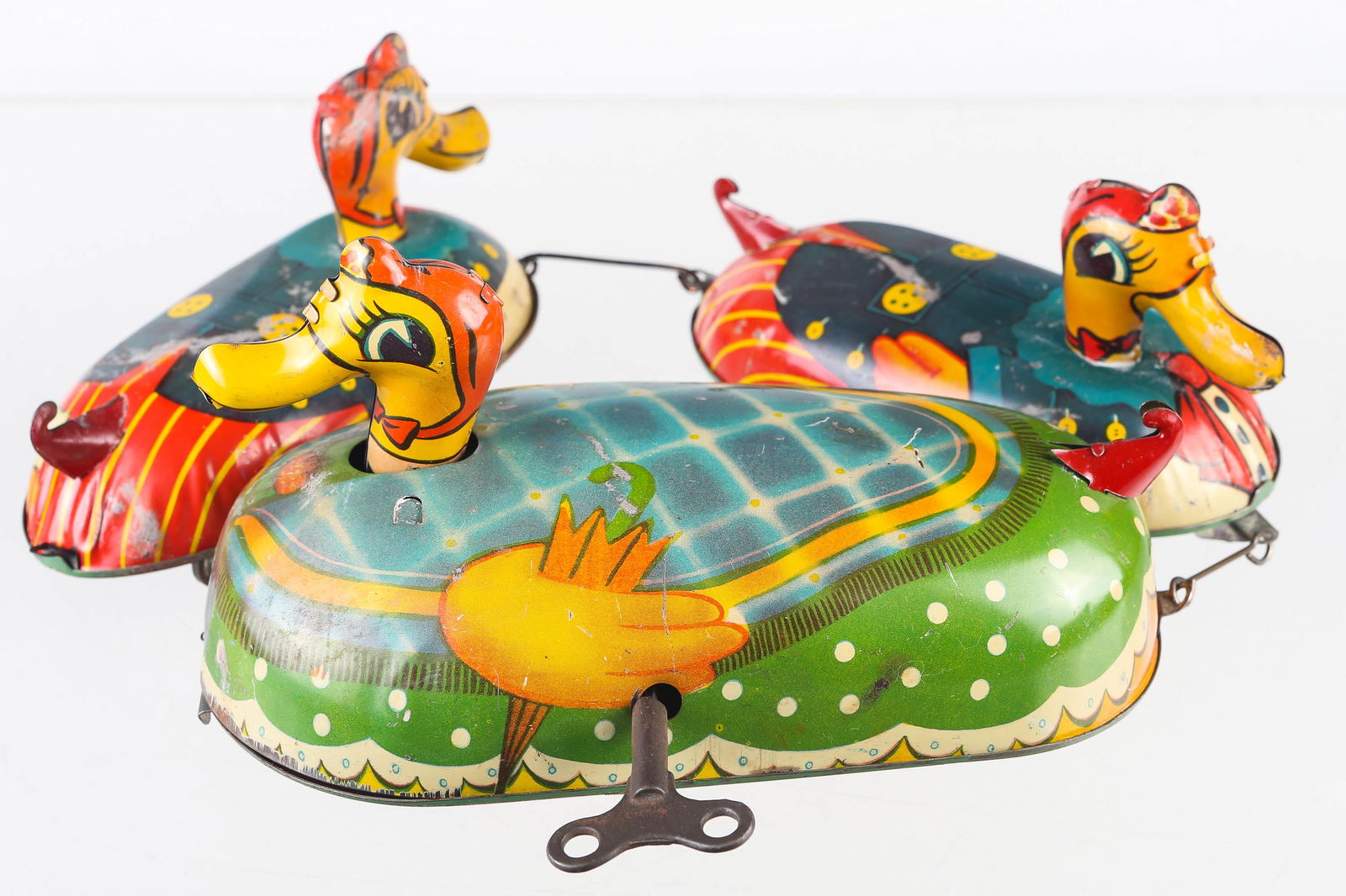 Tin Litho Wind-Up Duck Pull Toy: Litho duck trio does not appear to be working, paint is scratched throughout, total length is 28", and possibly had another duckling. No maker mark found.
