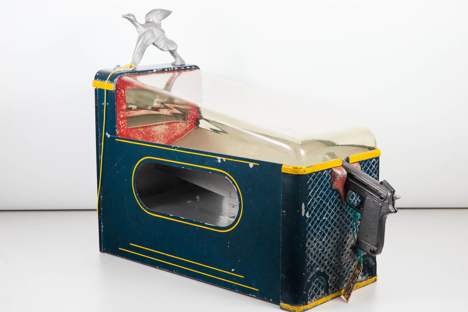 1949 Silver King Duck Hunt Gumball Machine Game: Approximately 18"H x 24"L including gun x 9"W. Original surface with common wear. Gun trigger mechanism functions. Aluminum duck finial. Plastic top caddy. Visible sights to interior. Gum dispenser at
