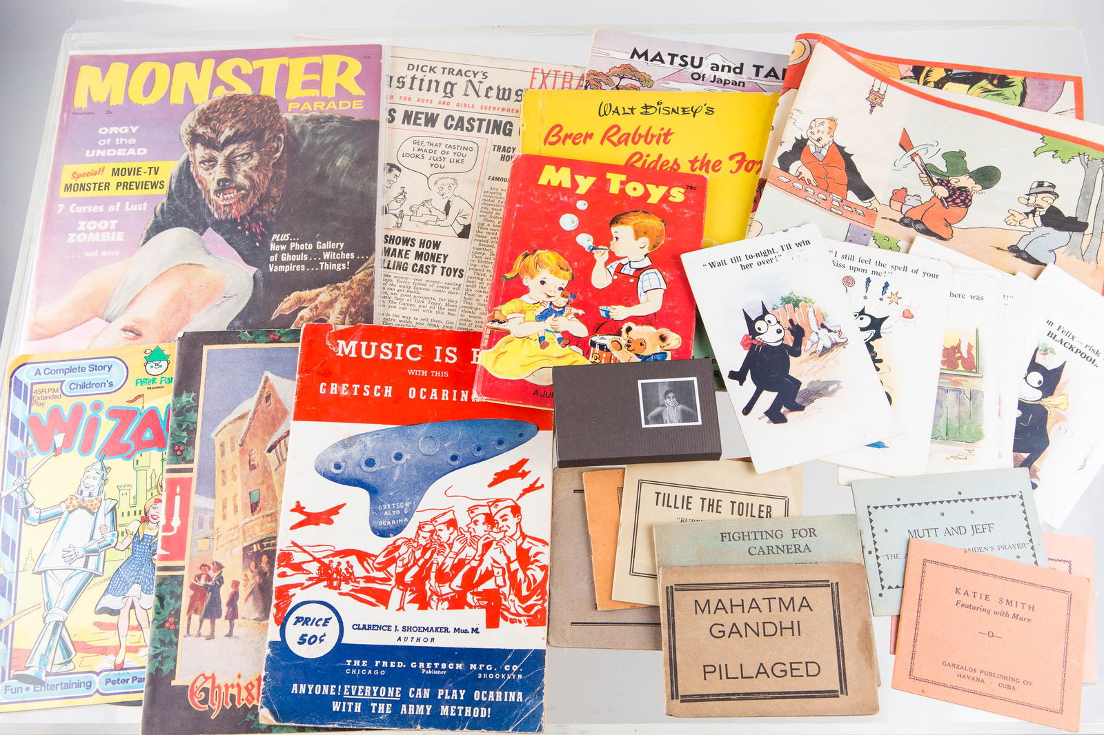 Mixed Ephemera Grouping: Lot includes Monster Parade magazine 35c, Dick Tracy casting news, Wizard of Oz record, various children's books, Popeye and other cloth panel, other small comic books, Tillie the Toiler items, and 8