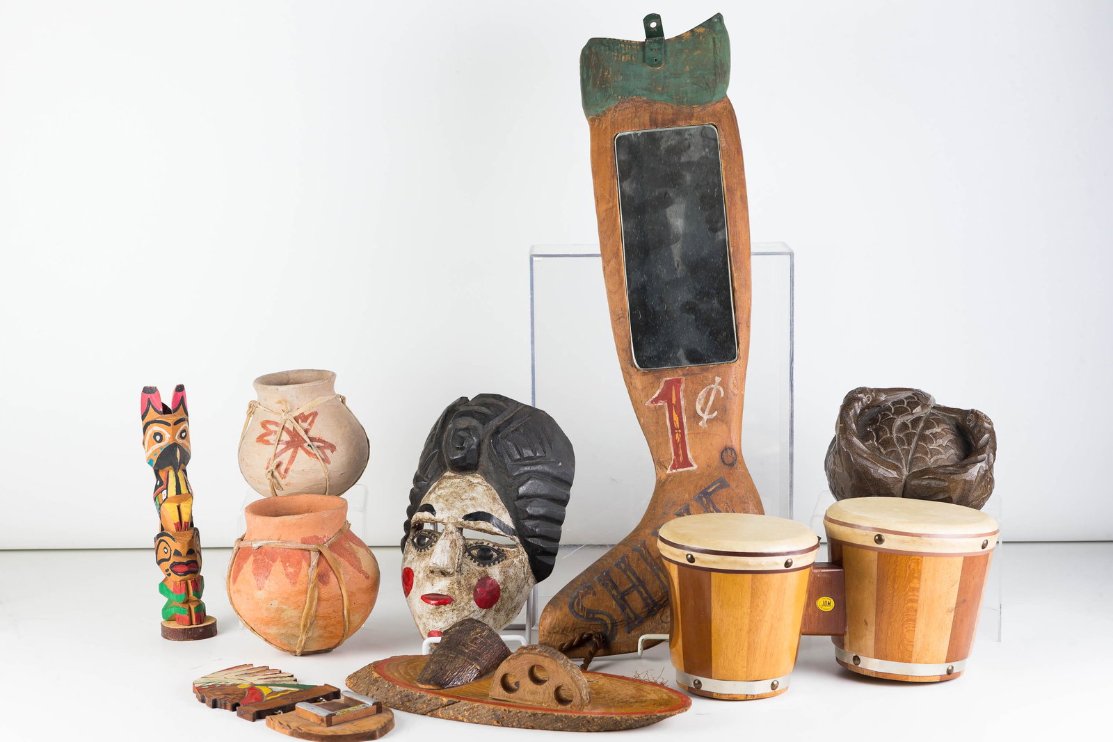 Native American, Carved Items, Drums: Lot includes two Mexican stoneware pots, Native American wall hanging match safe and totem pole, hanging match and pipe holder, a pair of tom tom drums, a double bird figure and a 20th C folk art shoe