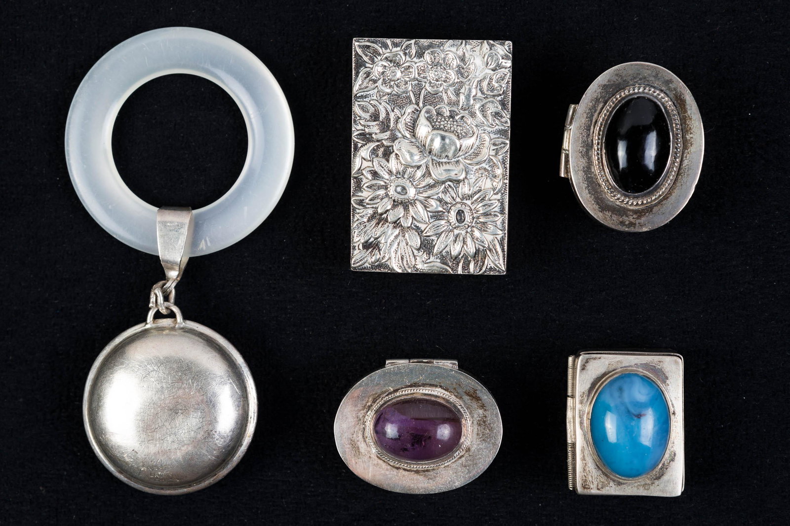 Vintage Sterling Pill Boxes and a Rattle: Three mexican Sterling Pill boxes with artist marks. a sterling rattle and a sterling match box safe.