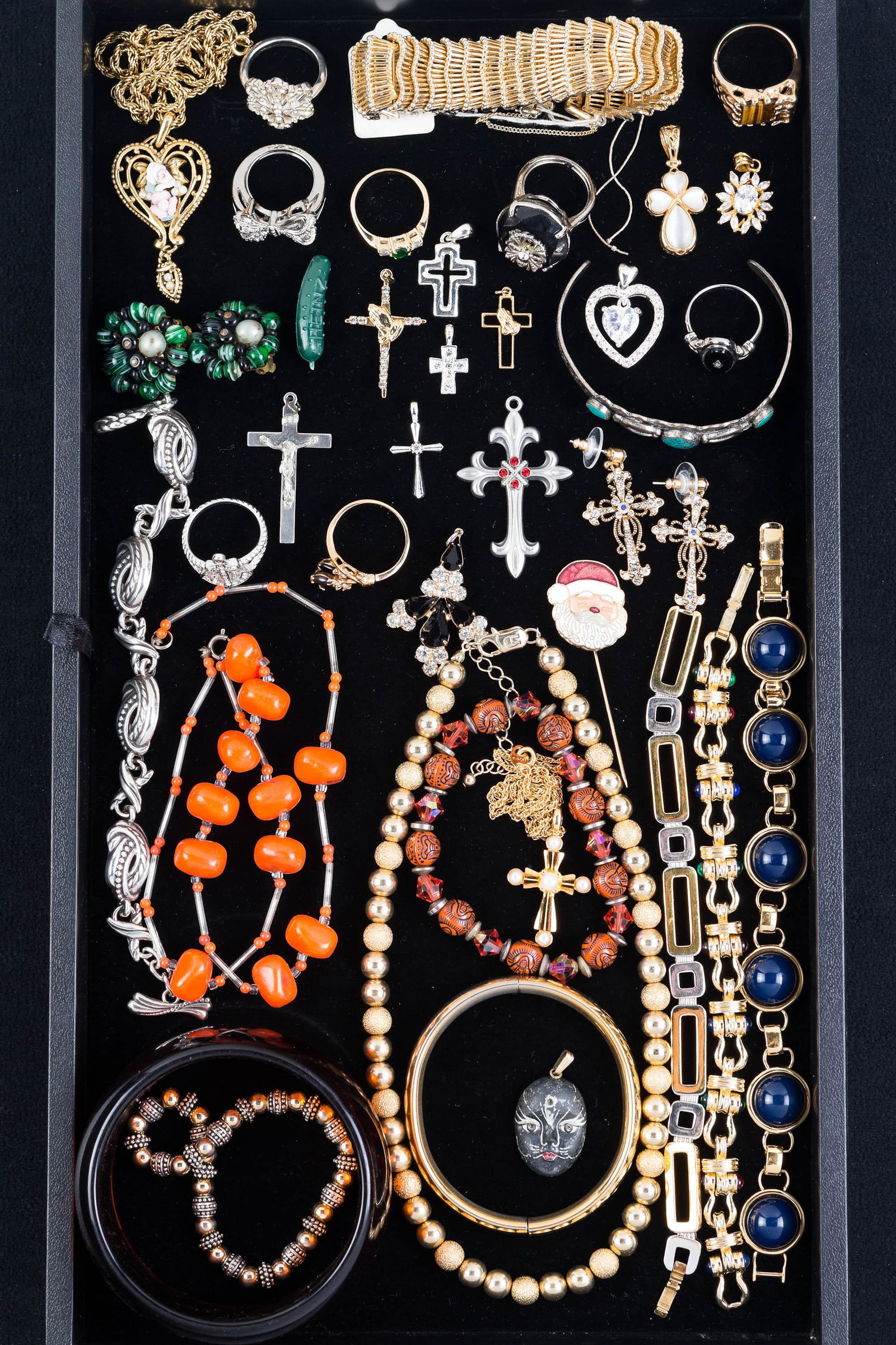 Boucher and other Costume Jewelry: Including a wide Boucher gold tone bracelet, silver and gold tone bracelets, pendants and crosses with rhinestones and related items.