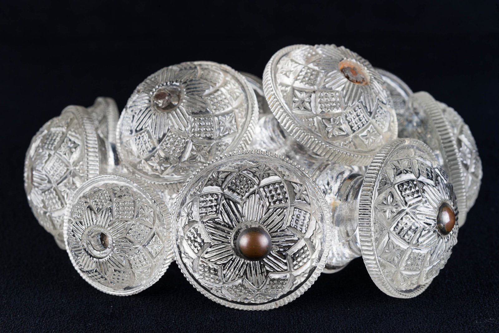 Victorian Glass Dresser Knobs: Lot includes 8 knobs (2.25" across, one damaged) and 2 (2"across). Matched set, all with nuts and screws.