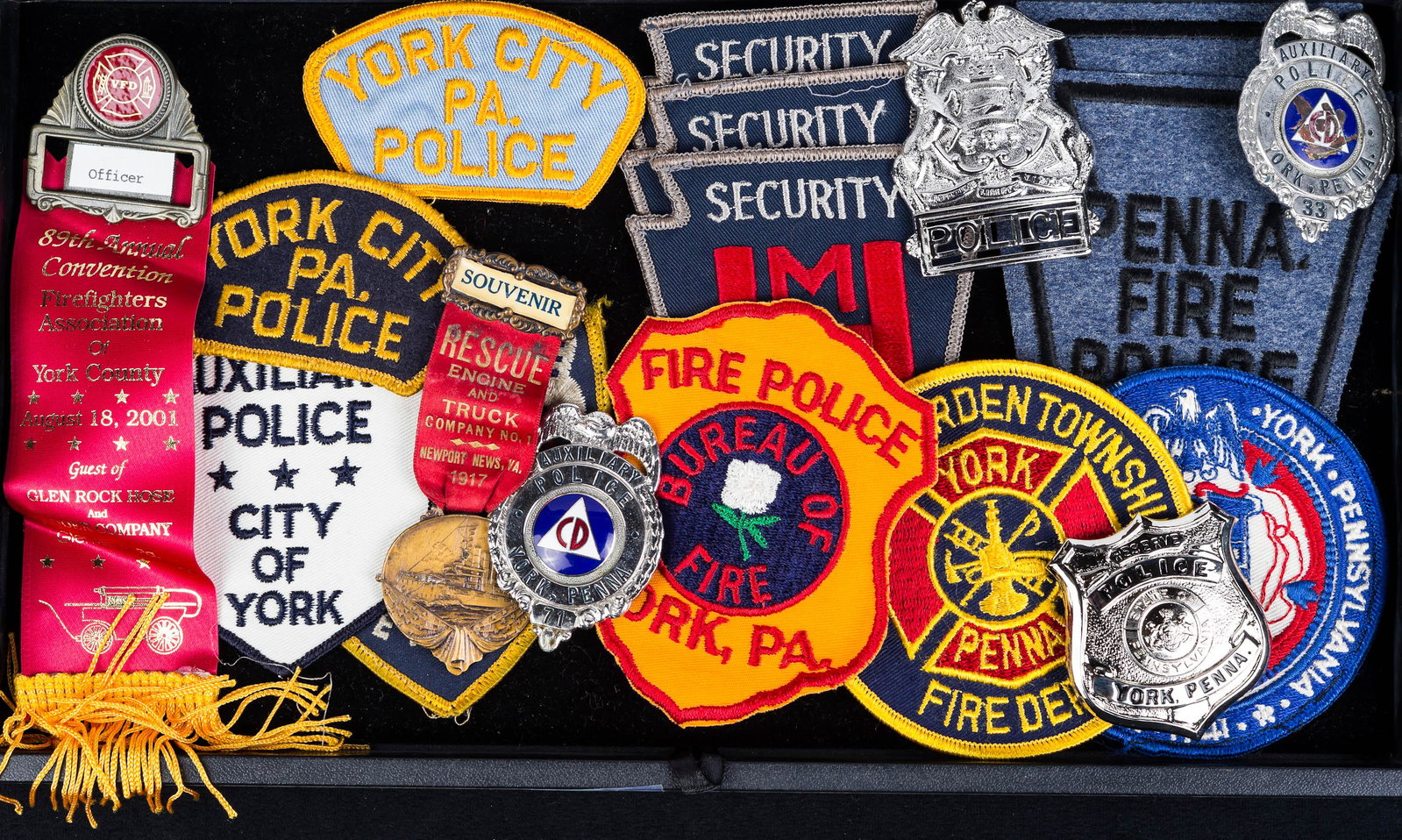 York PA Police Badges and other York Items: Fire and ambulance patches are included as well as other york items as seen in photo. 1917 rescue engine and truck co. and Newport News Virginia souvenir ribbon.