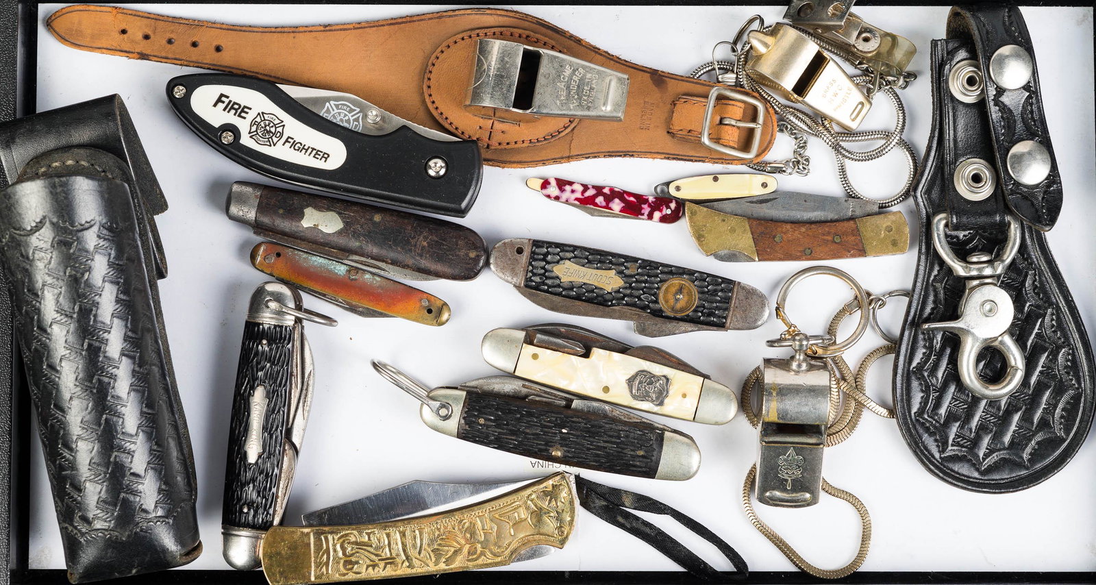 Pocket Knife and Whistle Collection: Includes scouting knife with compass, another scouting knife no compass, Cutmaster, Kamp-King, and various other knives. Two whistles one being a scouting whistle, flashlight belt holder, and another.