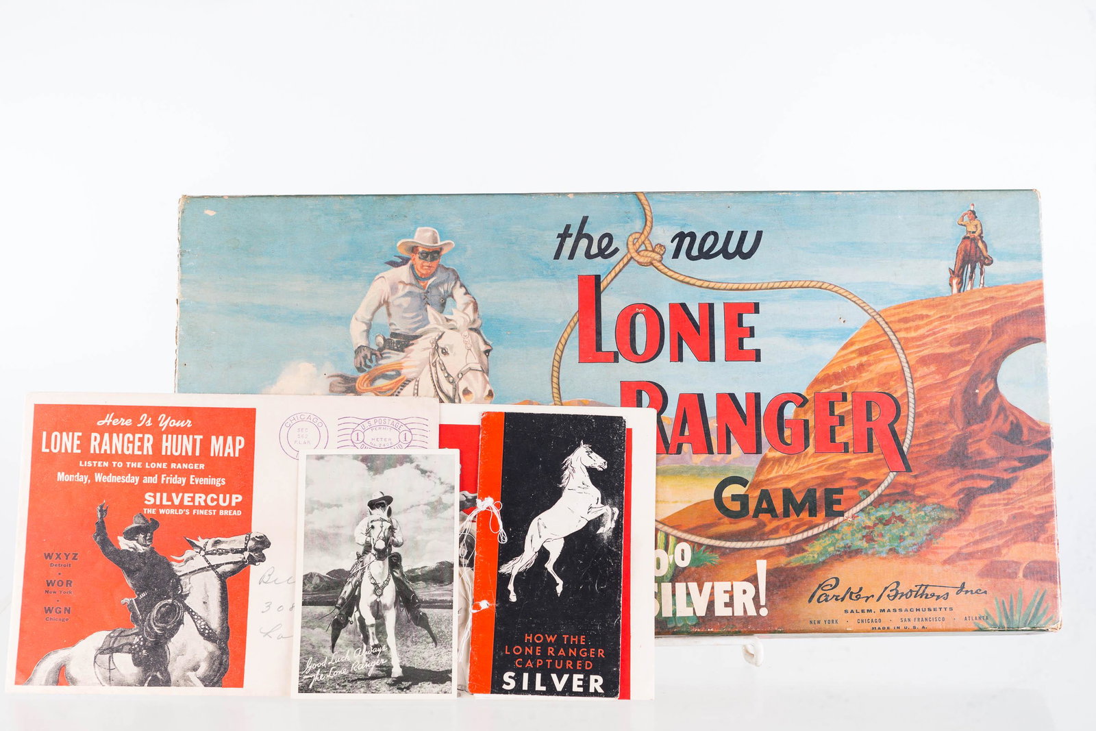 Lone Ranger Game and Ephemera: Lot includes Parker Brothers' The New Lone Ranger game (1956, appears to be complete), a Lone Ranger hunt map with envelope, How the Lone Ranger Captured Silver pamphlet (1936), and other items