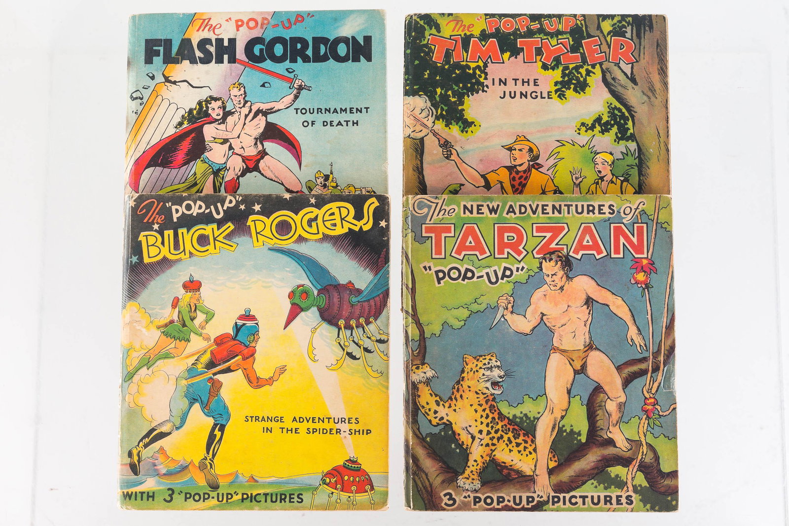 Buck Rogers and Other Pop UP Books: Lot includes Buck Rogers Battle with the Monsters pop up book with three pop ups (appears to be complete), Flash Gordon with three pop ups (handwriting on interior with owner's name, dated 1939), Tarz