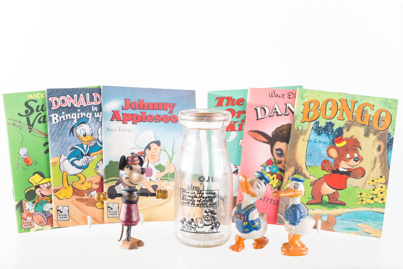 Wooden Minnie Mouse and Vintage Disney: Lot includes wooden Minnie Mouse figure with majority of original chest decal reading Minnie Mouse Corp by Walt E. Disney (approximately 4"H, complete with tail and ears), a HI Lo milk bottle with Dis