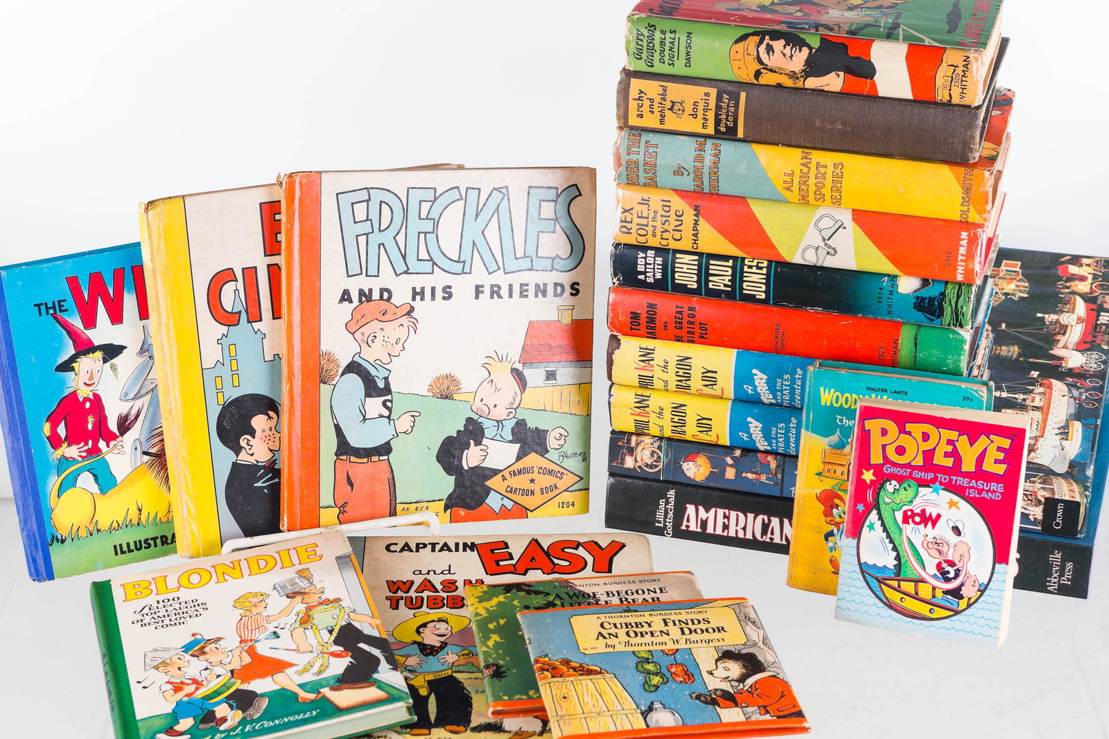 Whitman and Other Children's Hardback Books: Lot includes April Kane and the Dragon Lady, Blondie, Under the Basket, Freckles, Captain Easy, and The Wizard of Oz. Contemporary books include American Toy Cars and Trucks, and The Art of the Tin To