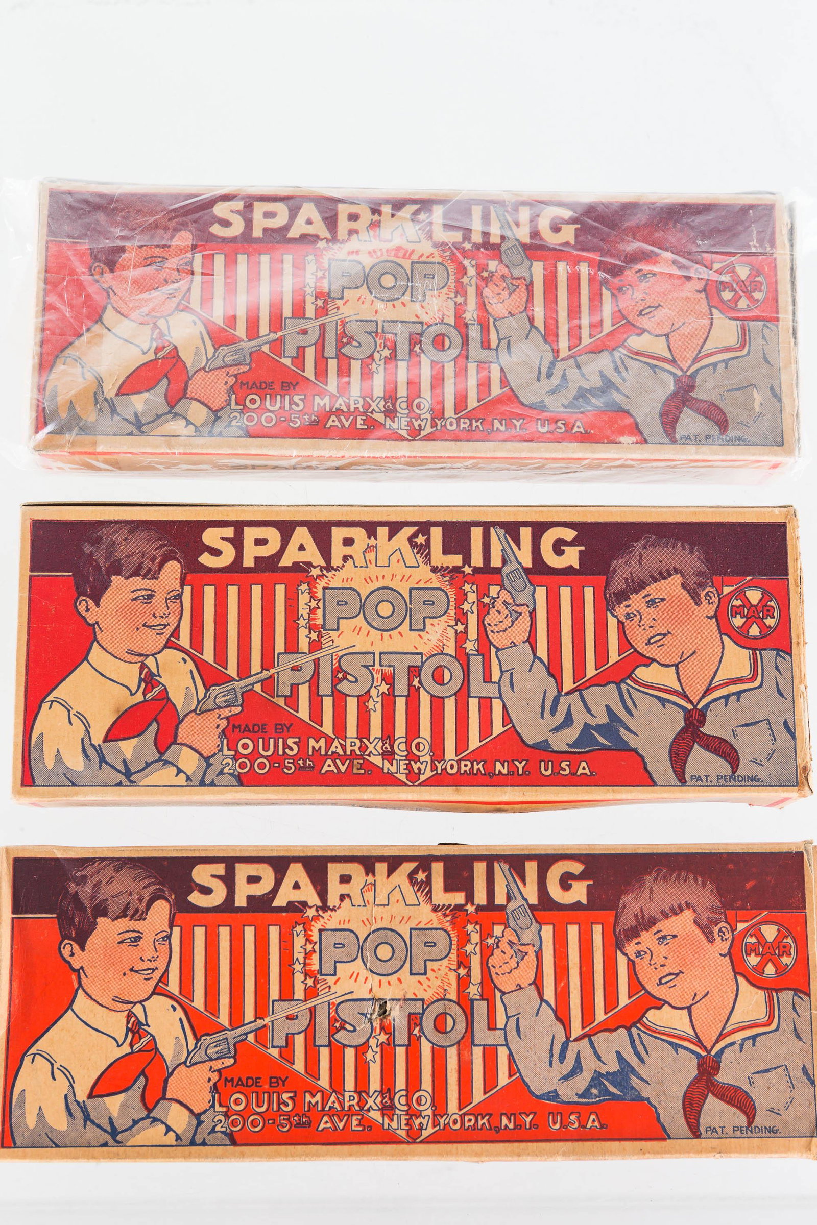 Marx Sparkling Pop Pistol Boxes: All have good lithography. All show minor common wear. One has small hole inside and small tear