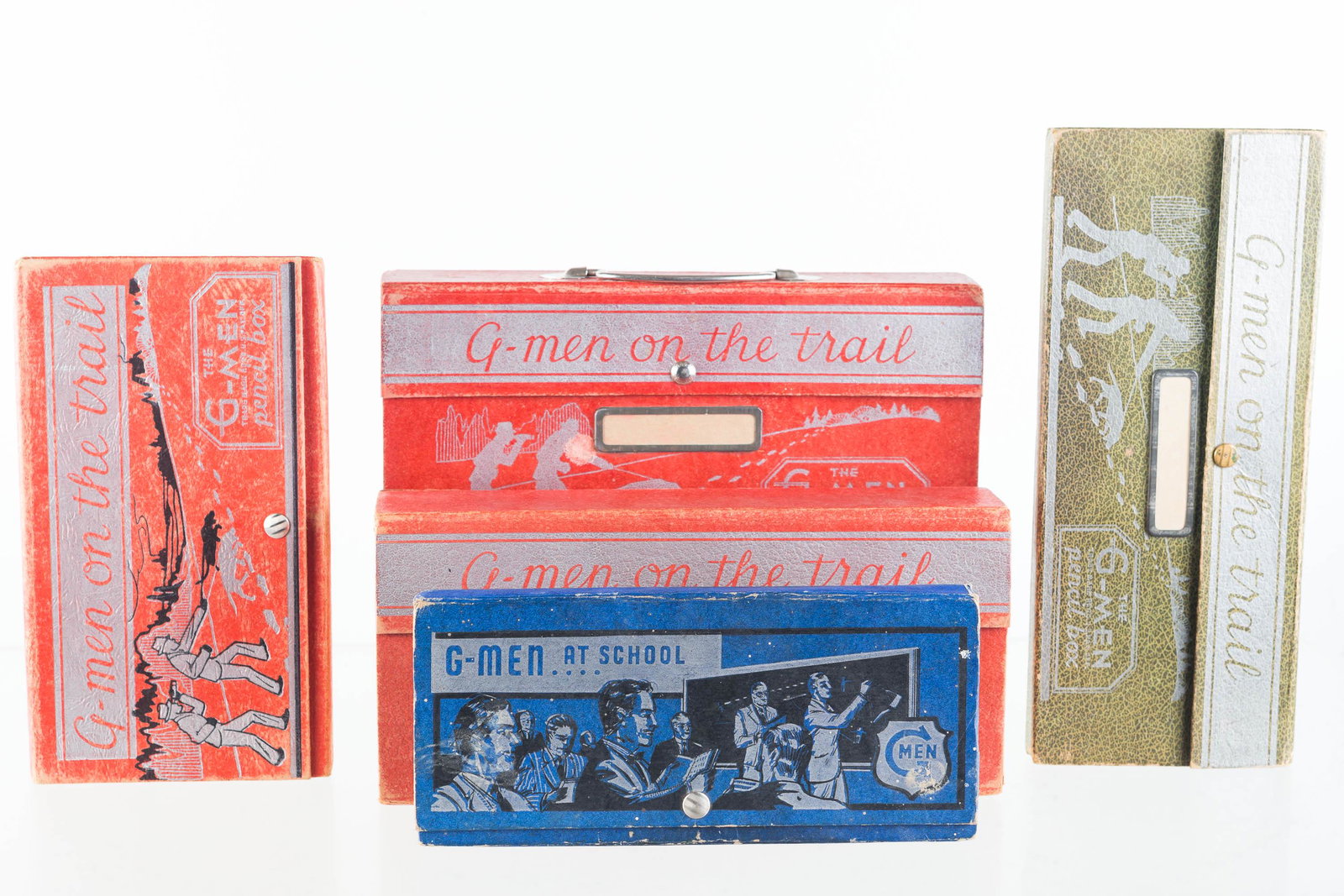 G-Man On The Trail Pencil Boxes: Lot includes 4 various G-Man On the Trail pencil boxes, each with some contents including crayons or rulers, and a G-Man At School pencil box with no contents