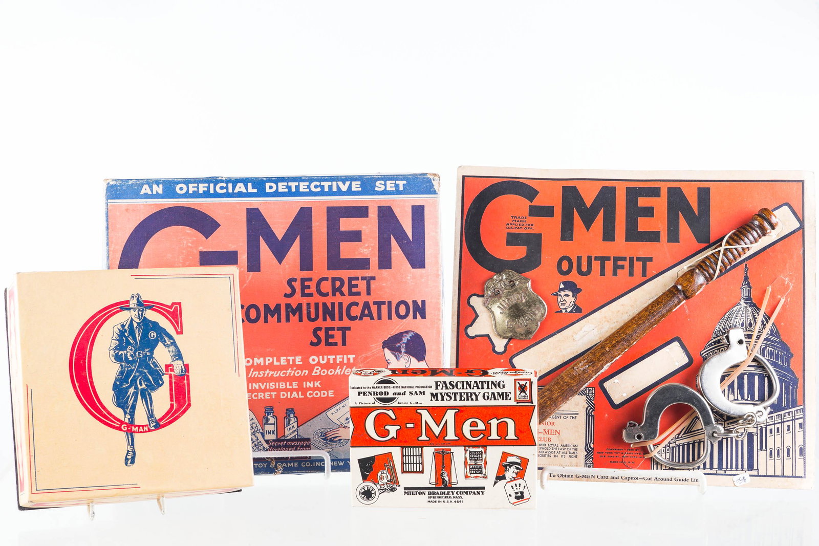 G-Man Toys and Games: Lot includes G-Man shoe brush set in original box, G-Man card game, G-Man outfit on hang card (missing one item), and G-Man Secret Communication set (1936, near complete)