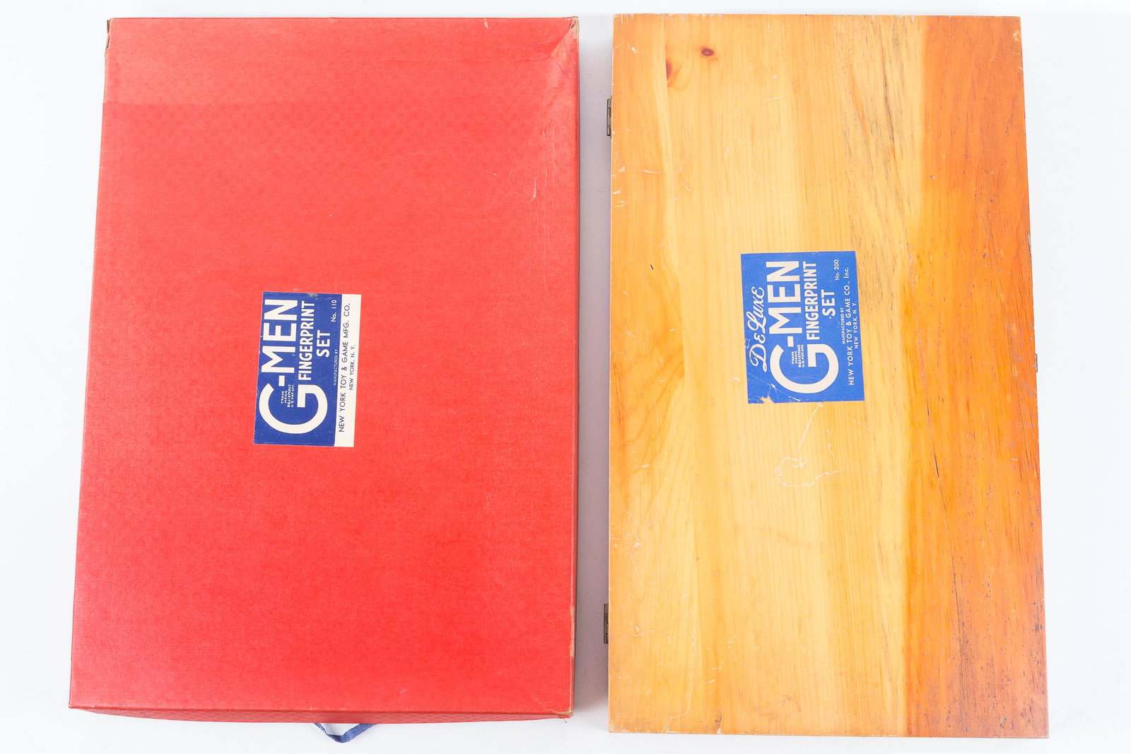 G-Man Fingerprint Sets: Lot includes Deluxe G-Men Fingerprint set No. 200 in wooden case. Possibly complete, but liquid jars are empty, and set No. 110 in red box with excellent interior graphics, which appears to be complet