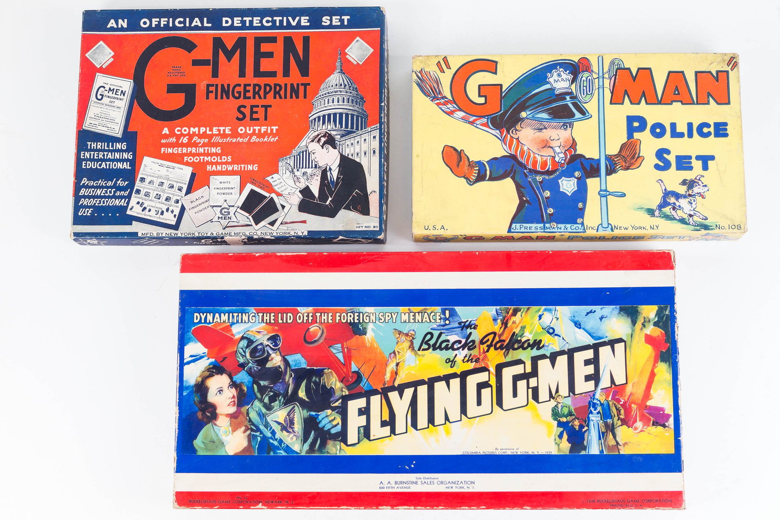 G-Man Games: Lot includes the Black Falcon of the Flying G-Man game. Item has game board, spinner, two styles of game cards, four airplanes, and a moving piece. Box is loose at corner. Lot also includes Jay Pressm