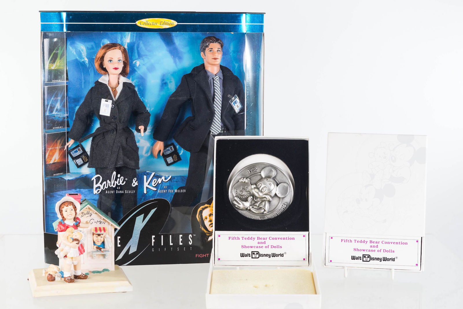 Disney, Convention Tokens and Other Toys: Lot includes two 5th Teddy Bear Convention and Showcase of Dolls pewter tokens NIB, a Barbie and Ken X-Files doll set NIB, and a Saturday Evening Post G-Man figure with broken gun