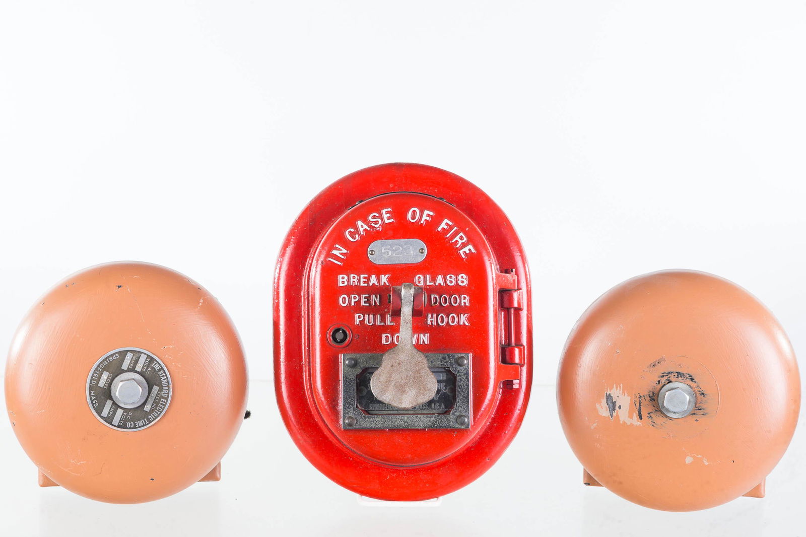 Vintage Fire Alarm Stations and Bells: Lot includes Standard fire alarm station with original brass tag and glass, and original surface. Lot also includes two Standard Electric Time Co. bells