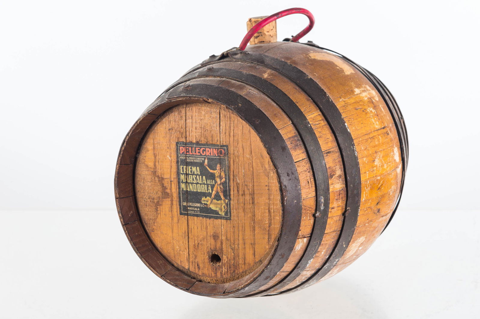 Vintage Pellegrino Marsalic Keg: Approximately 10"H. All wood construction with 6 bands (one is loose). Original Pellegrino tag on face and content tag on bottom. Missing plug.