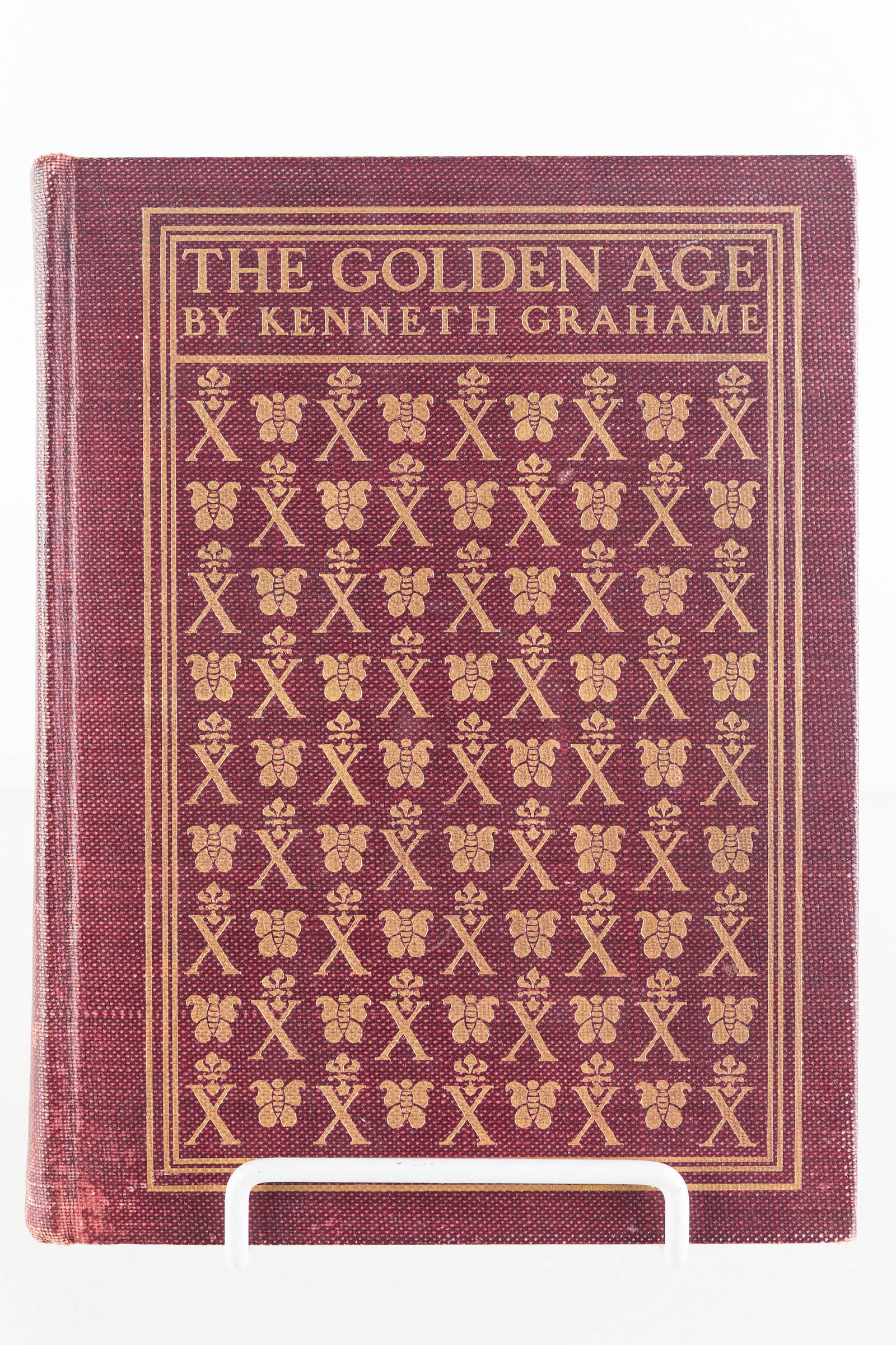 The Golden Age by Kenneth Grahame (1899): Hardback book, illustrated by Maxfield Parrish. Tight in binding. Last numbered page is 252. Cover in overall good condition, with common wear, and pages are tight. Copyright 1899 by John Laine, The U