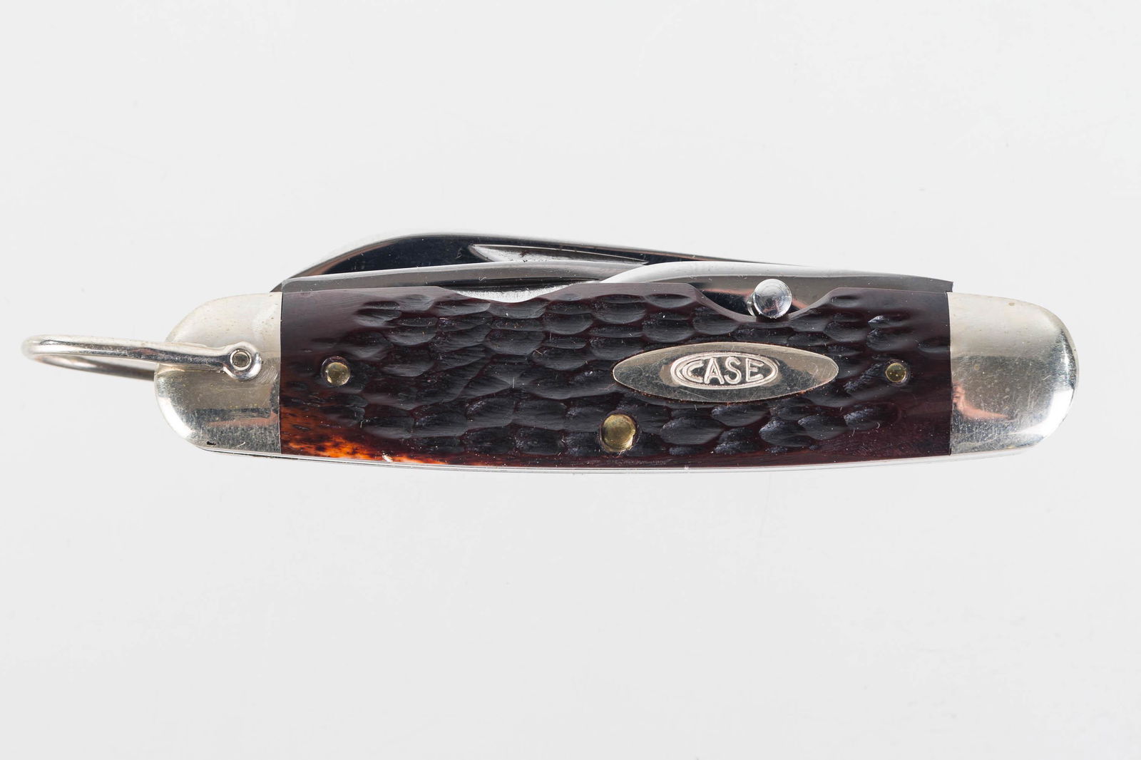 Case XX Four Blade Pocket Knife: Lot includes long and short blade, de-knotting tool with blade, and a bottle opener screwdriver. Knife is in clean condition and it is numbered 6445R.
