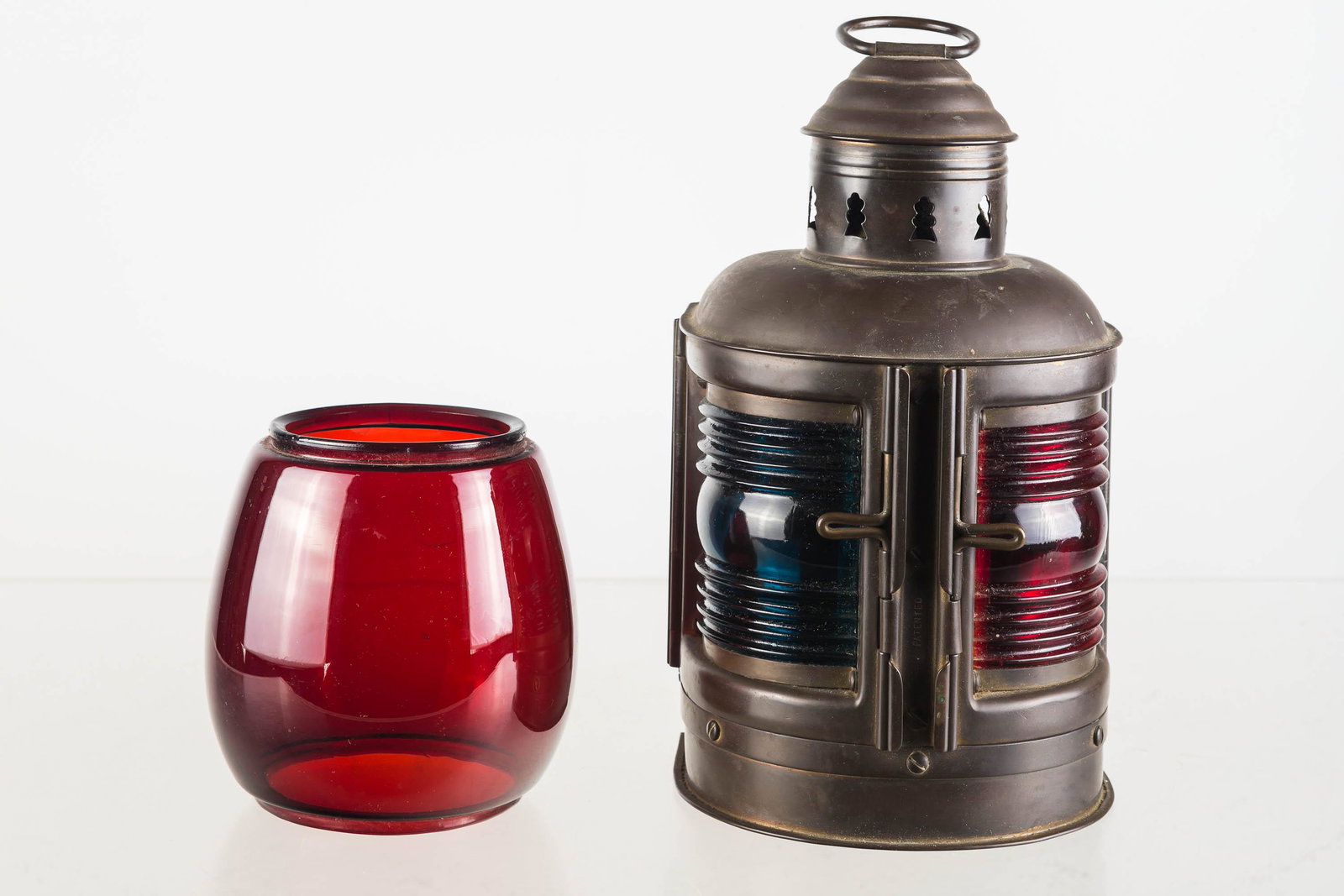Vintage Perko Brass Red and Blue Marine Lantern: Approximately 11"H to top of handle. Solid brass body, red and blue shade, and interior reflector. Marked Perko Marine Lamp and Hardware Corp, Brooklyn, NY USA. Interior has holders for two lamp items