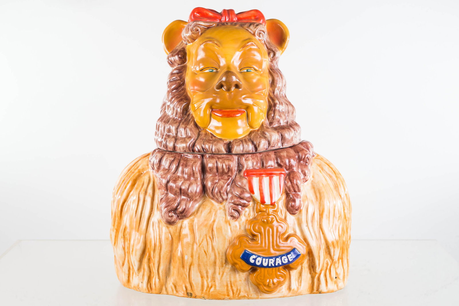 Star Cowardly Lion Cookie Jar: Approximately 15"H. Marked "Star 001 Cowardly Lion 1994 Turner Entertainment Ltd Edition". Item has a small surface flake on front.