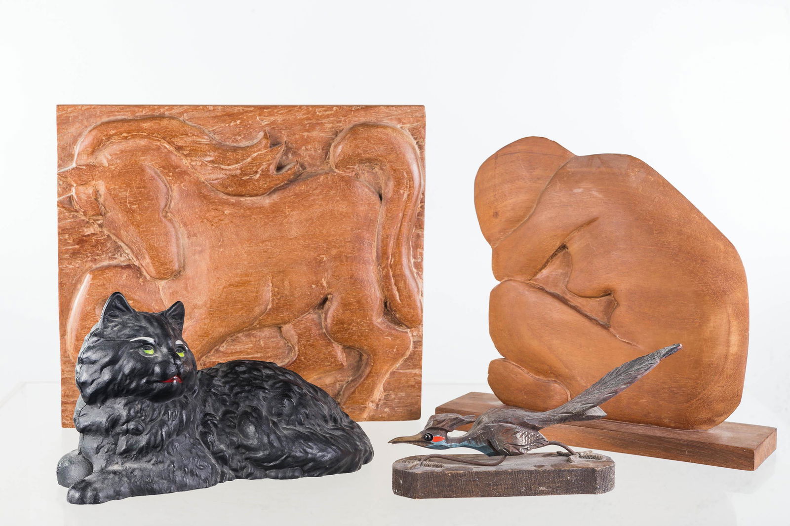 Mixed Figures: Lot includes a John Wright style cat door stop, two carved standups (signed Marion A Wright), and a carved roadrunner