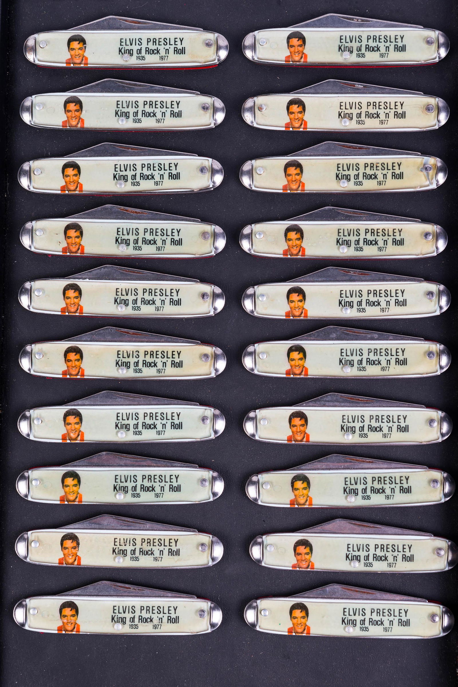 Elvis Presley USA Pocket Knives (20): Each knife approximately 6" fully open. Elvis logo on one side. All blades are marked USA. 20 total pieces. Most appear to be unused.