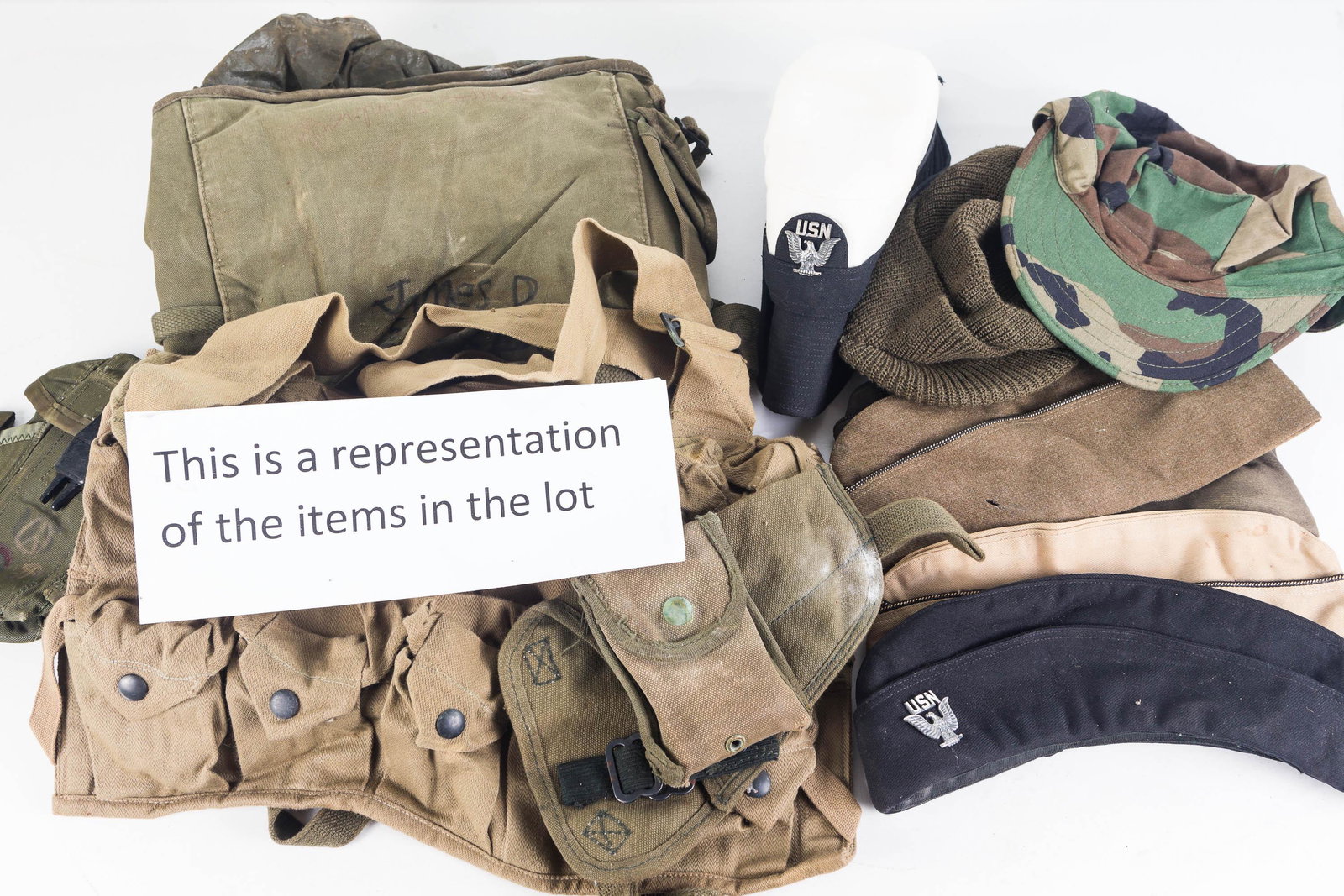 Military Caps and Packs: Lot includes 24 various military hats and caps, 6 packs, and a holsters. Conditions vary