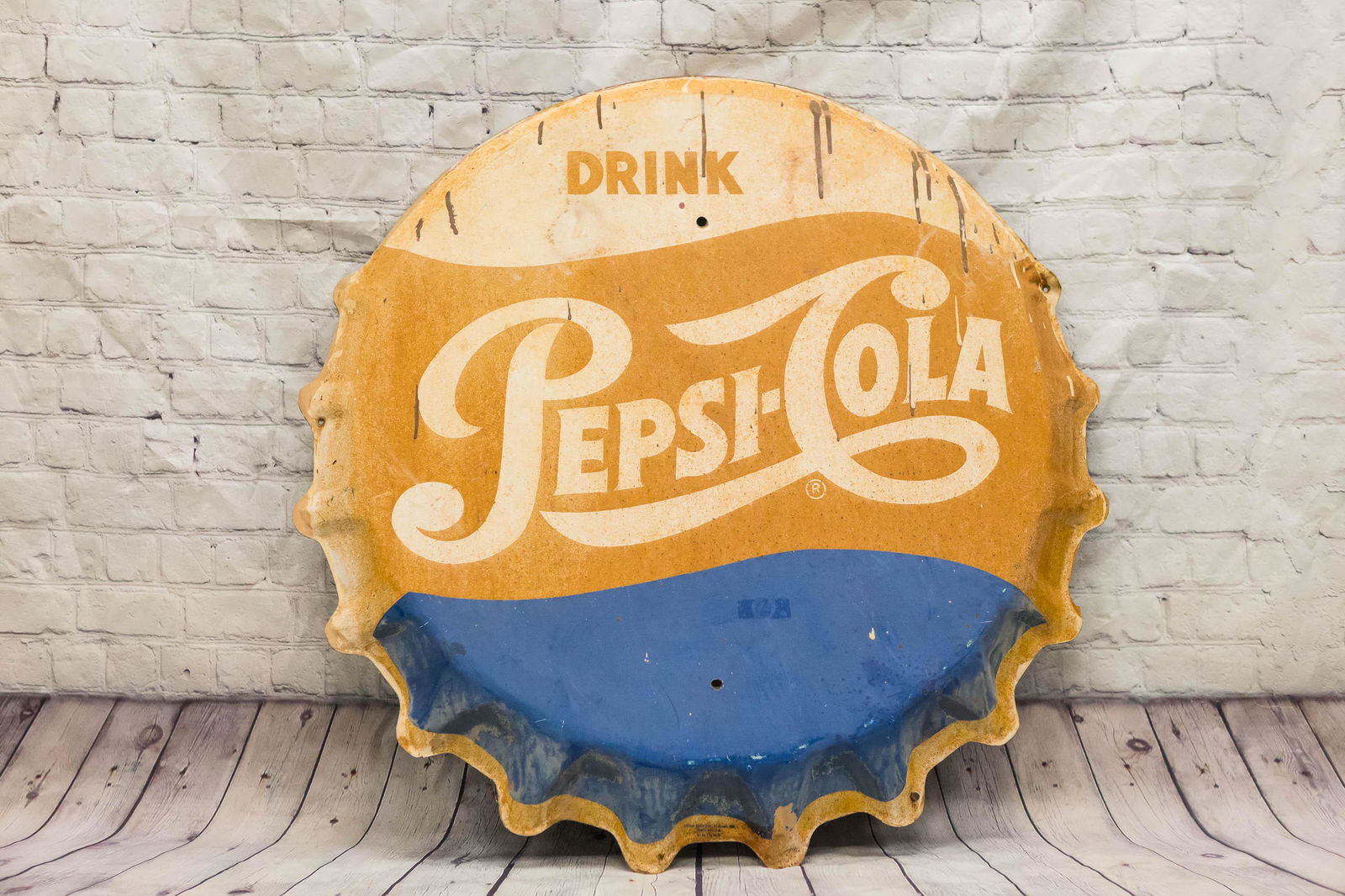 Pepsi Cola Bottle Cap Button Sign: Approximately 30" diameter. Three dimensional bottle cap. Produced by Stout Sign Co., Saint Louis, Missouri. Made in USA. Shows common wear due to weathering.