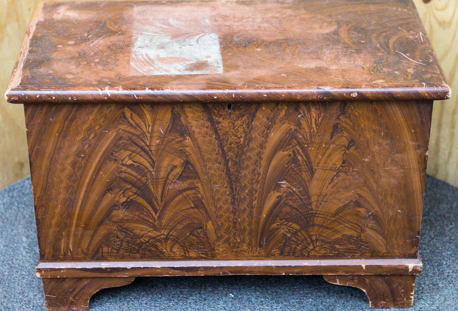 19th C Child's Feather Decorated Blanket Chest: Approximately 19"H x 29"W x 15"D. Softwood construction with original turkey feather decoration. Hand dove tailed body and it stands on simple bracket foot. Common wear and stain on top. Body retains 