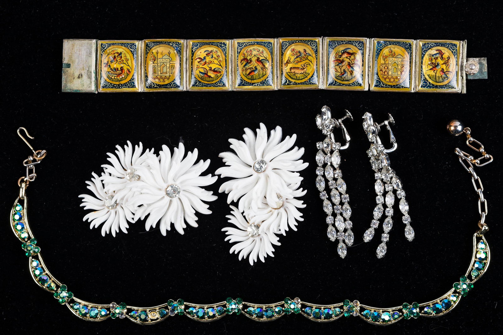 Vintage Estate Jewelry: Lot includes low grade silver Russian bracelet with paper mache panels backed on mother of pearl with bird and castle designs, "Lisner" green rhinestone necklace, and two large retro pairs of clip ear