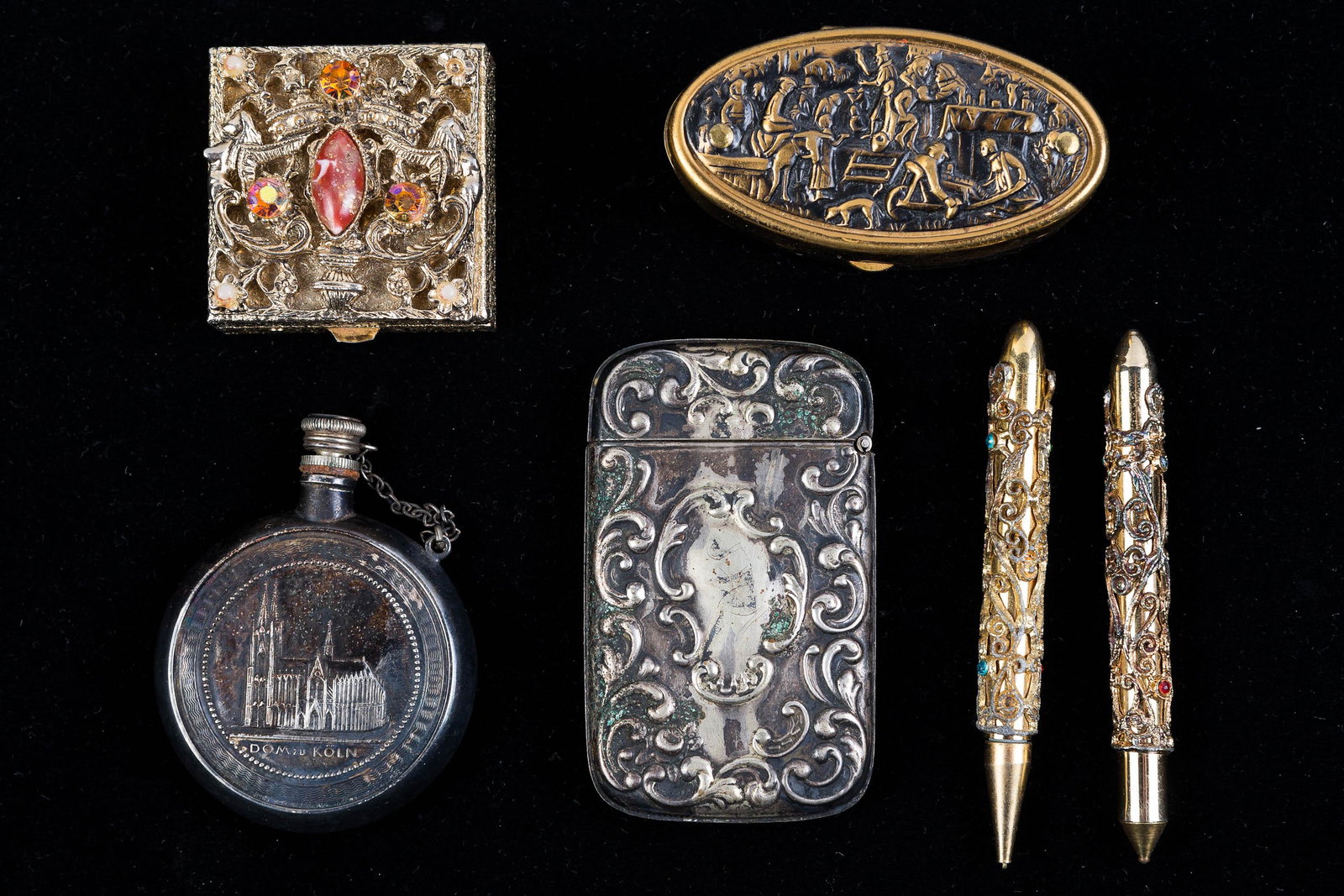 Vintage Match Safe, Trinket Boxes, Flask, Pens: Lot includes a Holy Water flask, vintage match safe, rhinestone and brass boxes, and two novelty pens.