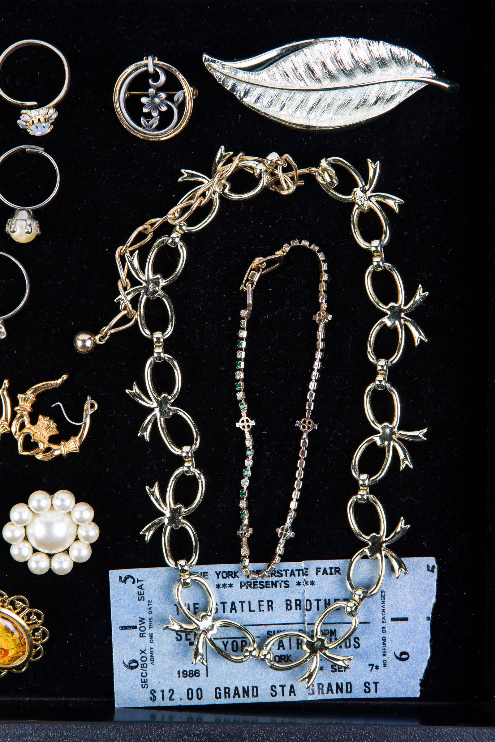 Estate Jewelry: Lot includes signed Art green rhinestone pear brooch, clip earrings, necklaces, brooches and more.