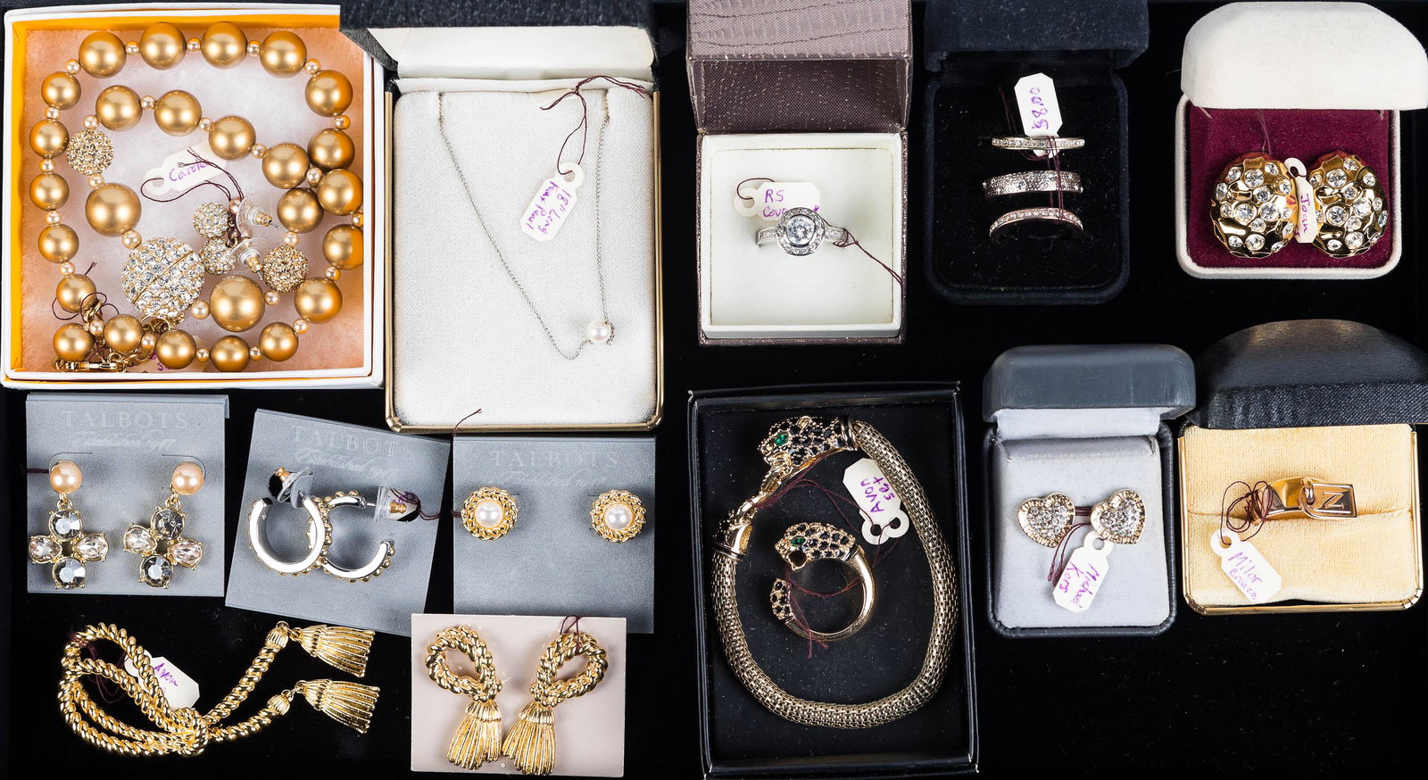 Designer Costume Jewelry Grouping: Lot includes a Carolee necklace and earring set, Joan Rivers and Michael Kors earrings, two pairs of earrings from Talbots, an RS Covenant ring, and a leopard bracelet and ring set.