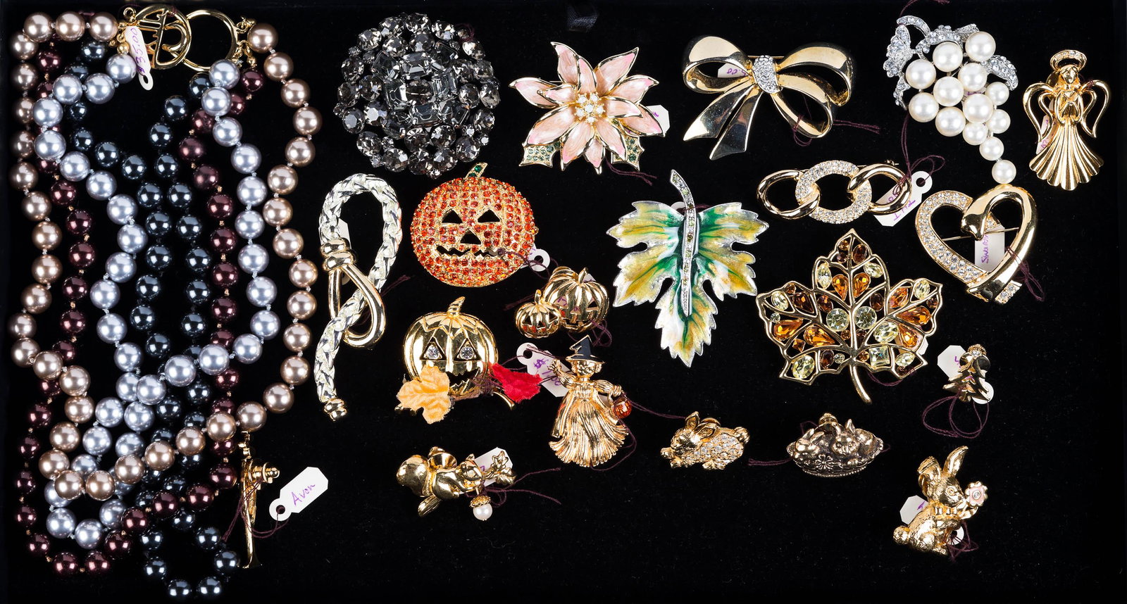 Holiday and Other Costume Jewelry: Lot includes Halloween pins, Easter Bunny pins, Monet enameled leaf pin, and related costume jewelry.