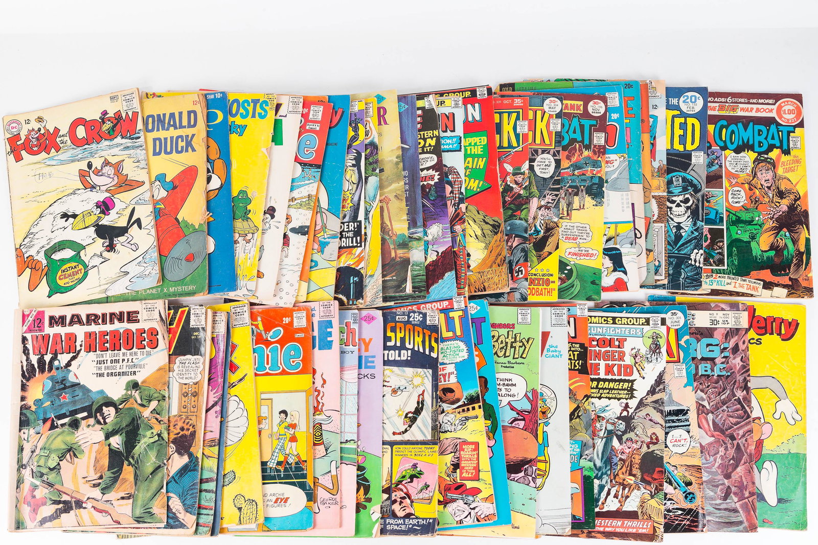 Mixed Comics 10c and Up: Lot includes 10c Scamp, several 12c comics including Marine War Heroes, Baby Huey, 25c Daredevil, Rawhide Kid, and others.