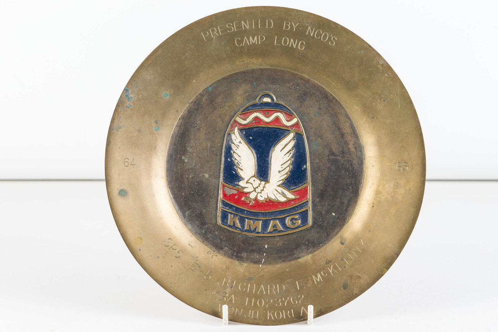 Military Brass Presentation Plate from Korea: Approximately 9" diameter with enameled center. Presented by NCO's Camp Long 1965, from Wang Ju, Korea.