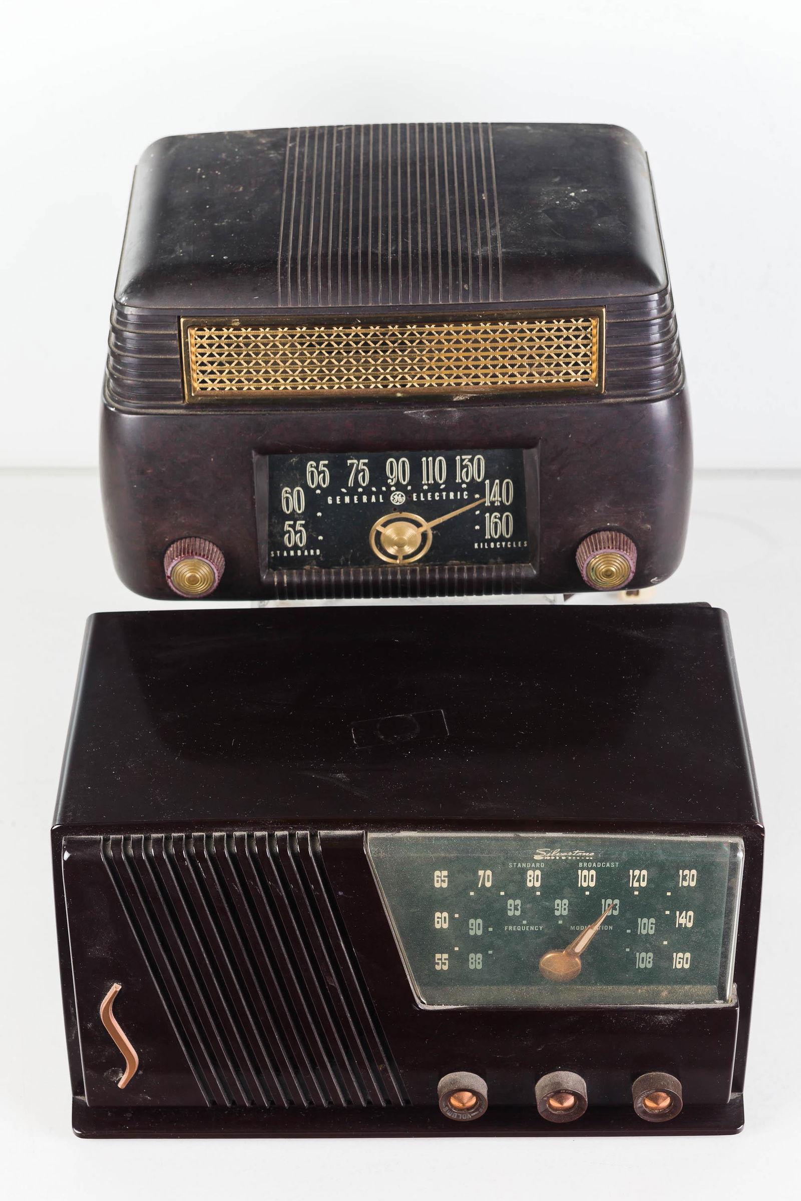 Vintage Silvertone and GE Radios: Lot includes a brown tube Silvertone radio, Catalog No. 18 and a General Electric catalin Model No. 202 radio. Both radios untested.