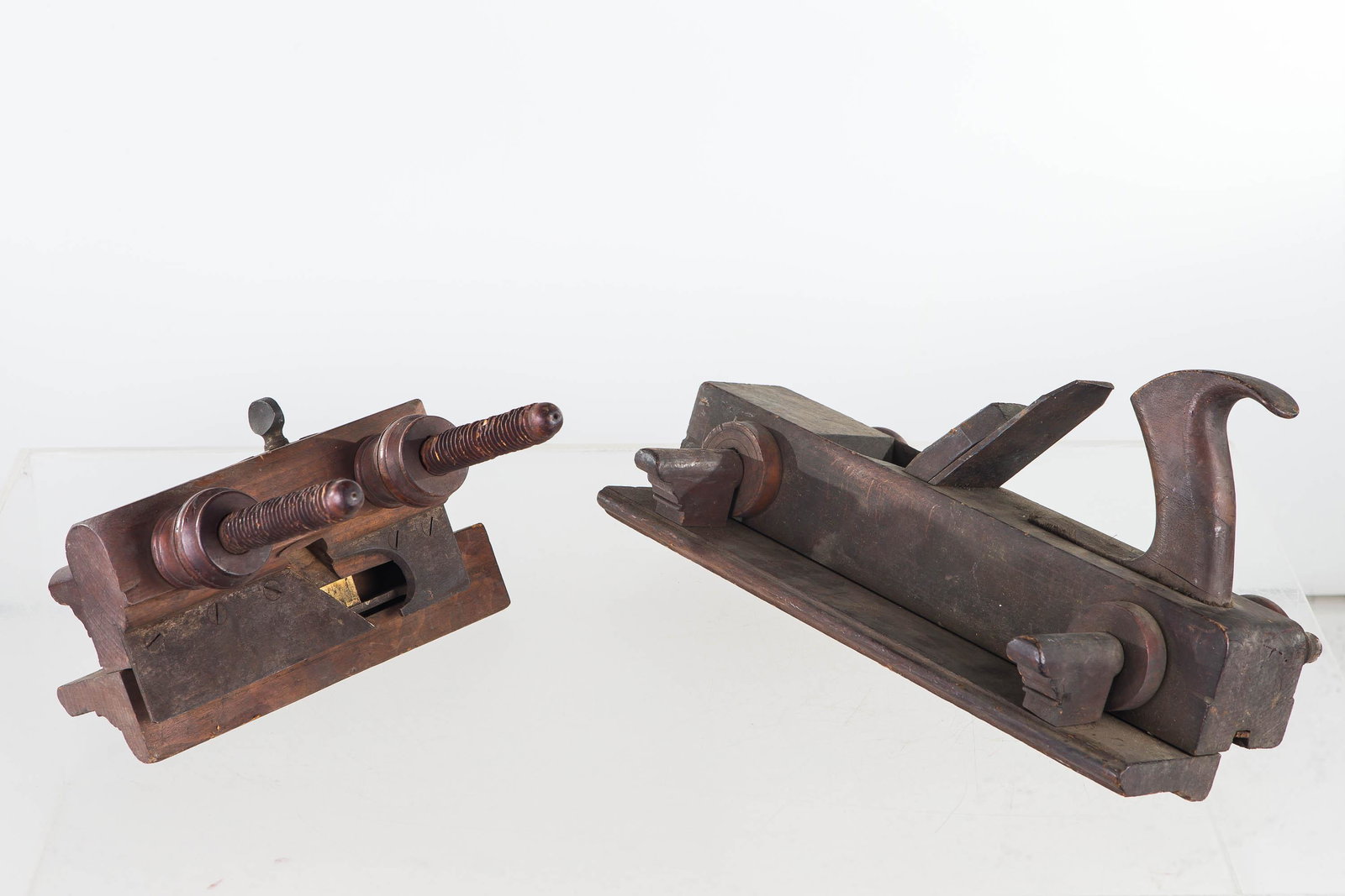 Cabinet Makers Molding Planers, 19th C: Largest approximately 14"L, with two adjustment dowels with knobs, and a double interior blade. Second has two dowels with adjustments on box sides, manufactured by Israel White (stamp has address and