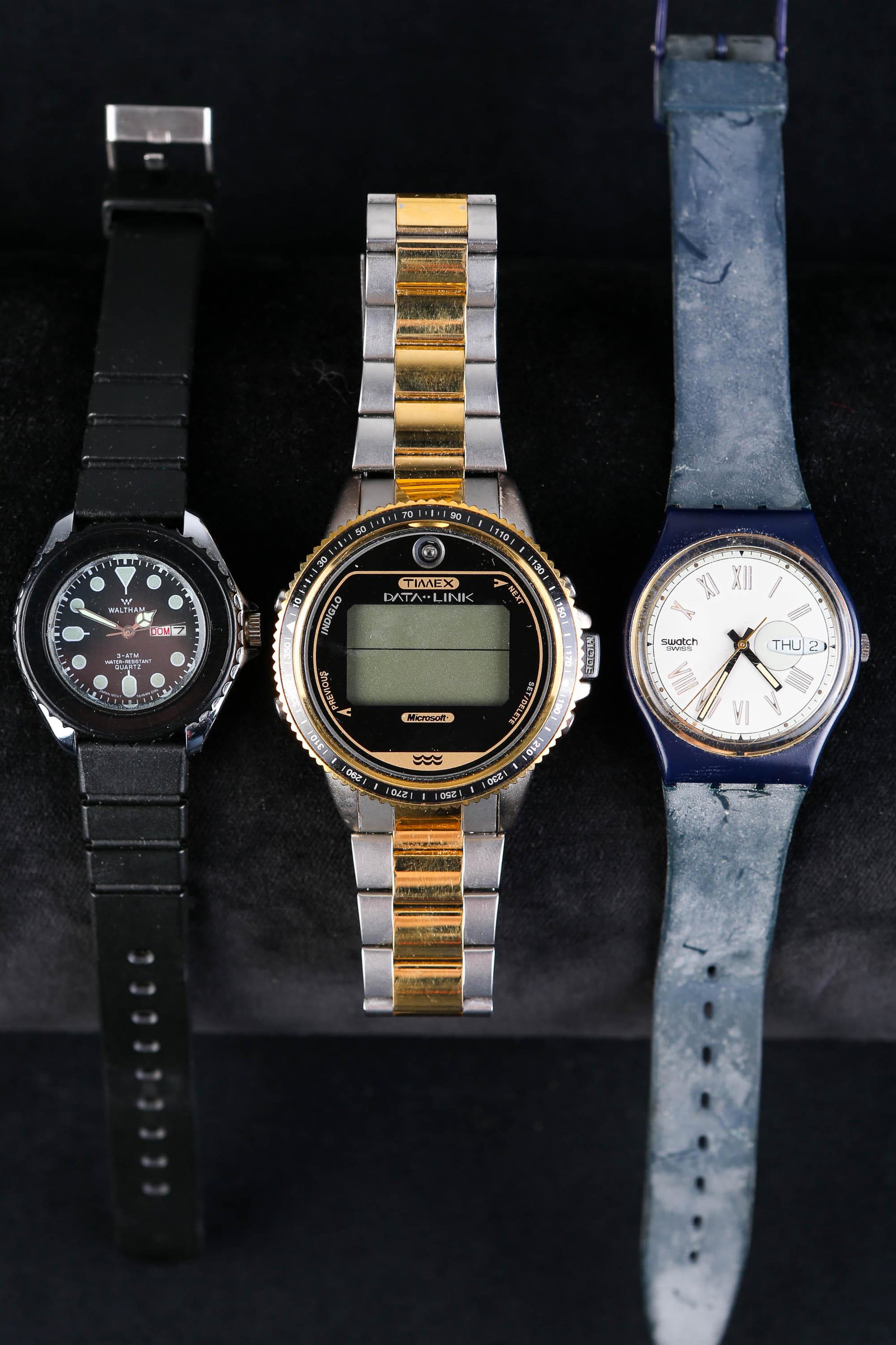 Swatch, Waltham, and Timex Wristwatches: Lot includes Swatch watch with day and date, with rubber band (reads Patented and Water Resistant on back), Waltham with day and date, face reads Waltham 3-ATM Water Resistant Quartz (back reads Water